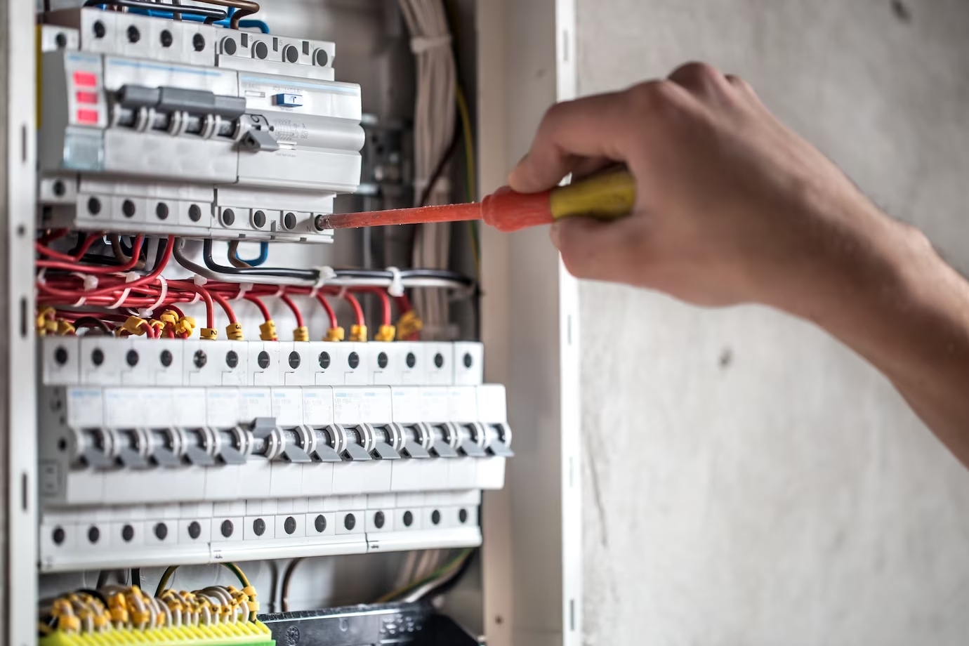 electrician repairing a electric panel